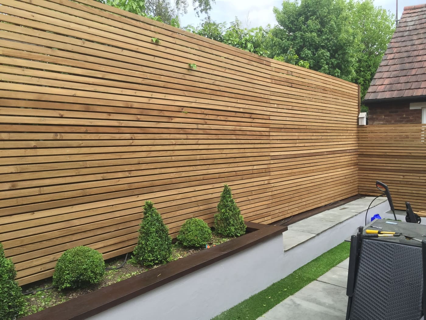 Timber slatted boundary and patio outdoor works
